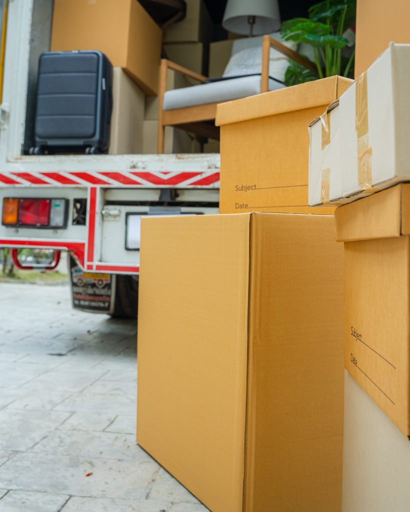 House moving service,Boxes waiting to be moved into a new home. House moving service,Boxes waiting to be moved into a new home.
